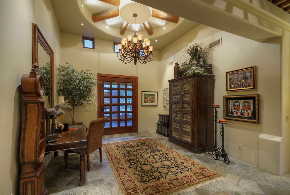 Design ideas for a large country foyer in Phoenix with beige walls, granite floors, a single front door and a medium wood front door.