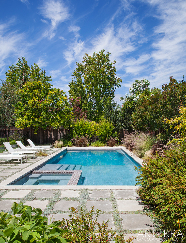Inspiration for a country rectangular pool in San Francisco with a hot tub and natural stone pavers.