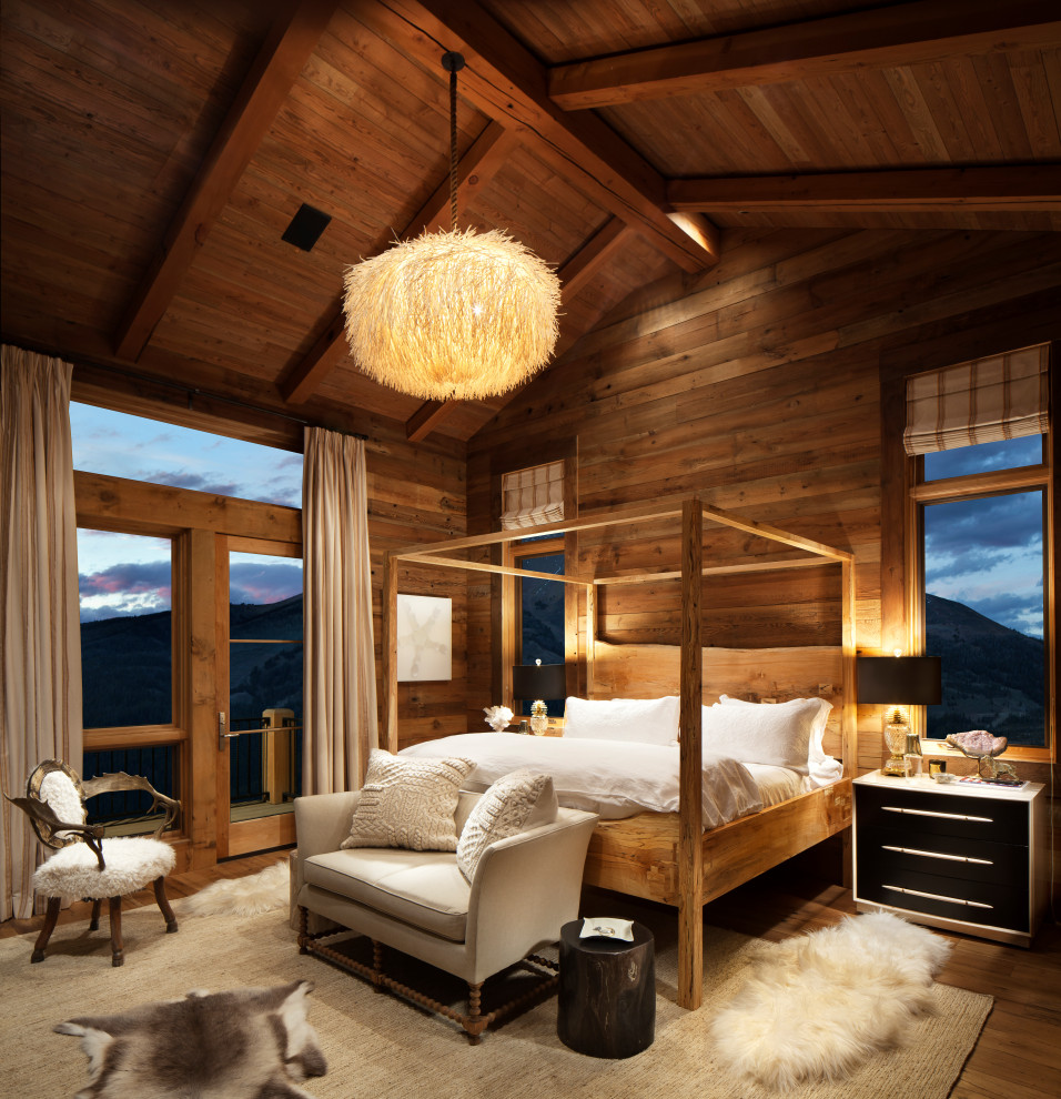 Large rustic master bedroom in Other with dark hardwood flooring, brown floors, a wood ceiling, wood walls, brown walls and no fireplace.