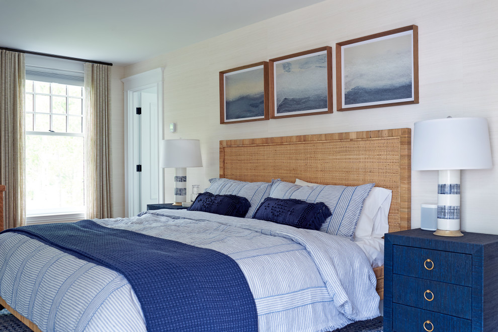 Design ideas for a coastal guest bedroom in Portland Maine with beige walls and wallpapered walls.