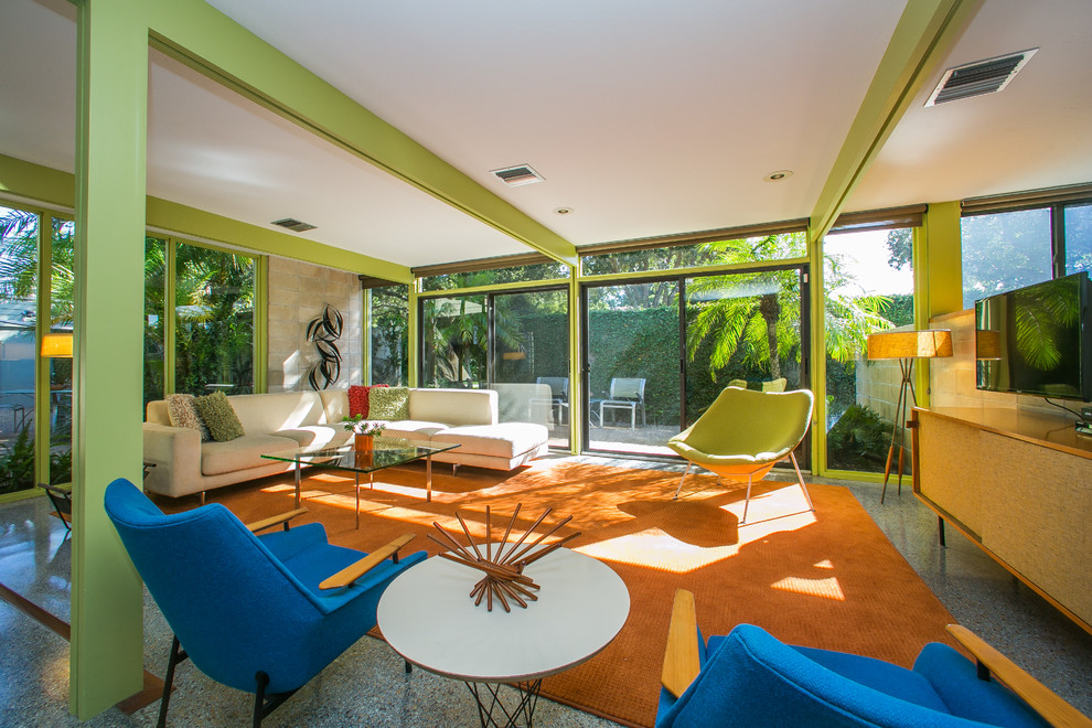 Mid-sized midcentury sunroom in Tampa with no fireplace, a standard ceiling and grey floor.