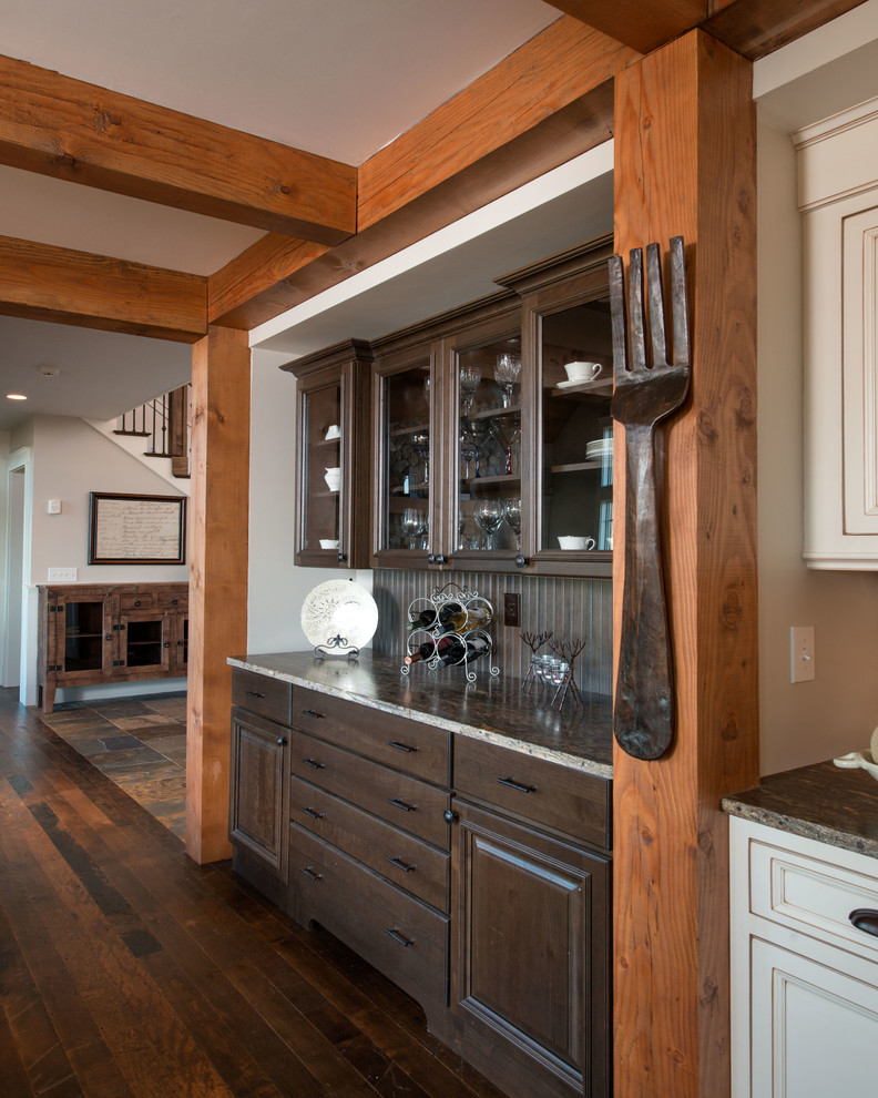 Kitchen - transitional dark wood floor and brown floor kitchen idea in Burlington with white cabinets