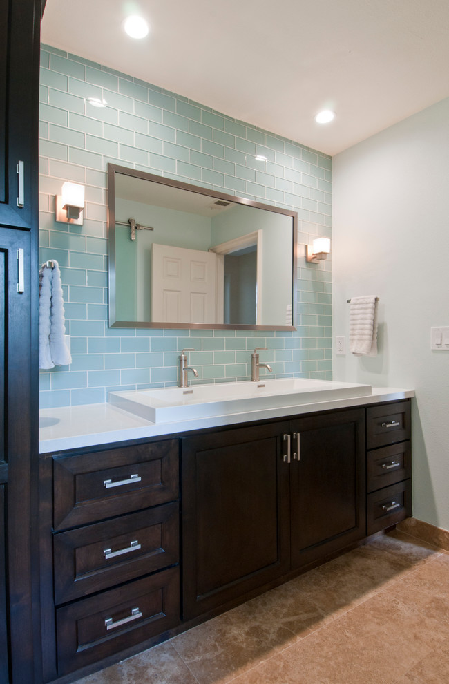 Inspiration for a mid-sized contemporary master bathroom in Orange County with blue tile, dark wood cabinets, a trough sink, shaker cabinets, subway tile, grey walls, ceramic floors, engineered quartz benchtops, brown floor and white benchtops.