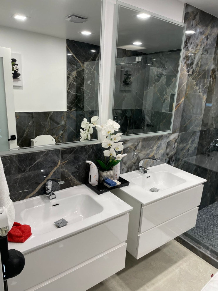 Inspiration for an ensuite bathroom in Miami with white cabinets, a double shower, a one-piece toilet, black tiles, porcelain flooring, a built-in sink, quartz worktops, beige floors, a hinged door, white worktops, a wall niche, double sinks and a floating vanity unit.