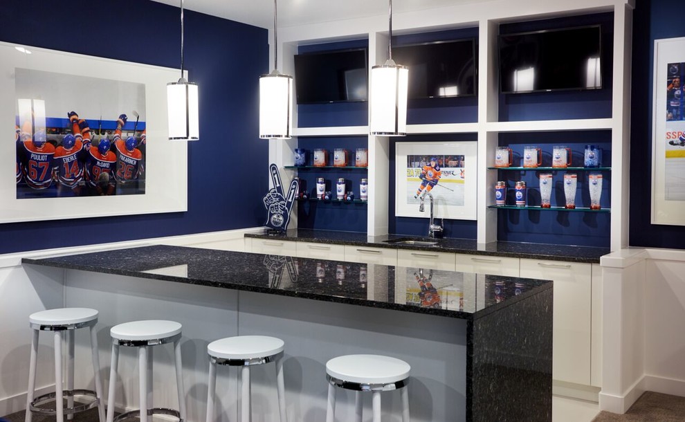 Inspiration for a large contemporary single-wall seated home bar in Toronto with an undermount sink, flat-panel cabinets, white cabinets, granite benchtops, blue splashback and carpet.