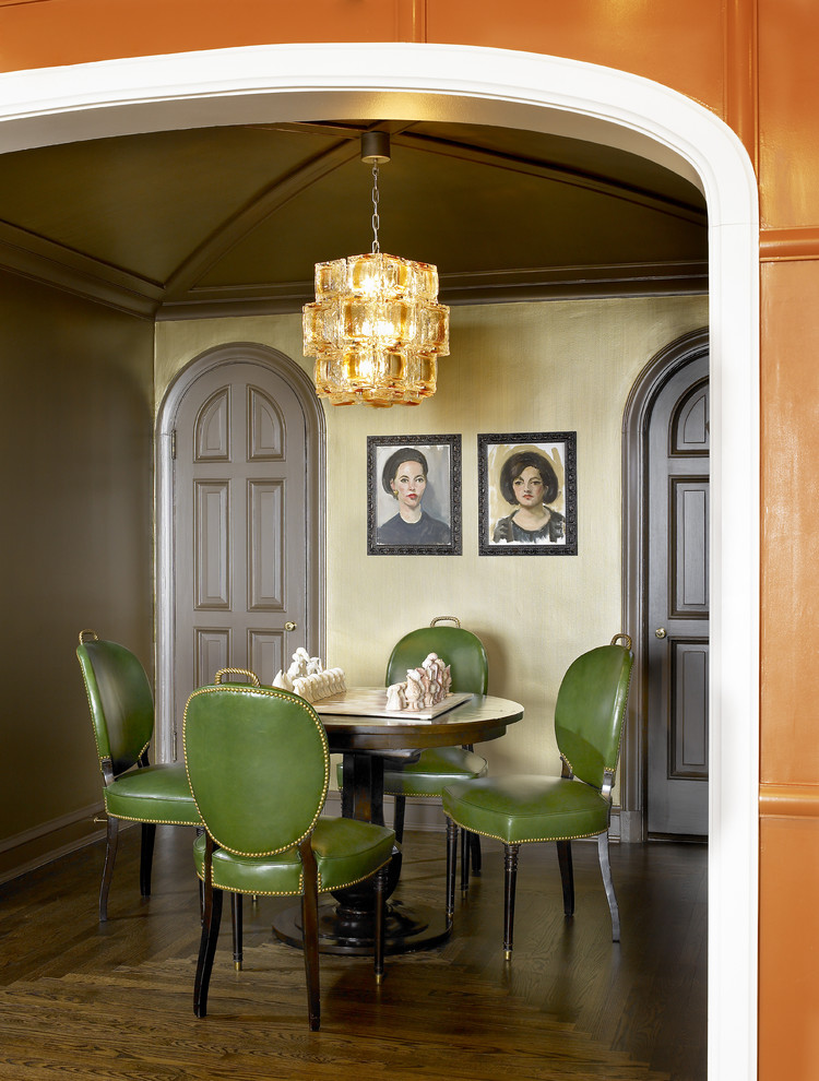 This is an example of an eclectic dining room in Chicago with dark hardwood floors.