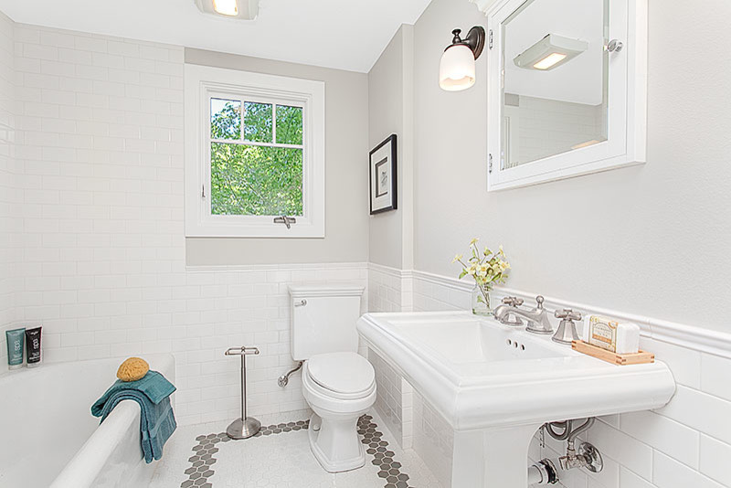 Inspiration for a mid-sized beach style 3/4 bathroom in Seattle with a shower/bathtub combo, grey walls, ceramic floors, a pedestal sink and engineered quartz benchtops.