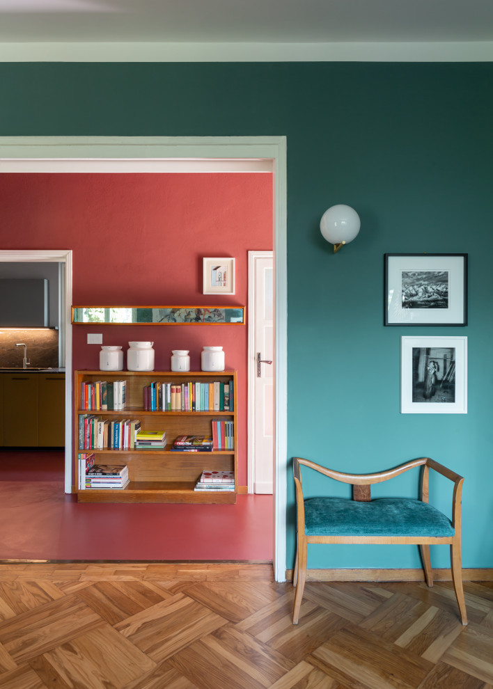 Inspiration for a mid-sized midcentury hallway in Other with red walls, concrete floors and red floor.