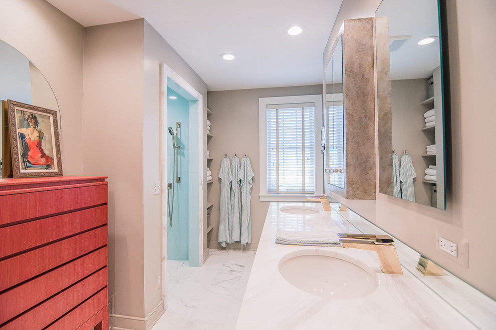 Alcove shower - mid-sized transitional master blue tile and porcelain tile marble floor and white floor alcove shower idea with flat-panel cabinets, beige walls, an undermount sink and marble countertops