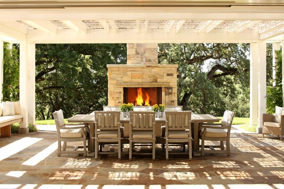 Photo of a transitional patio in San Francisco with a fire feature and a pergola.