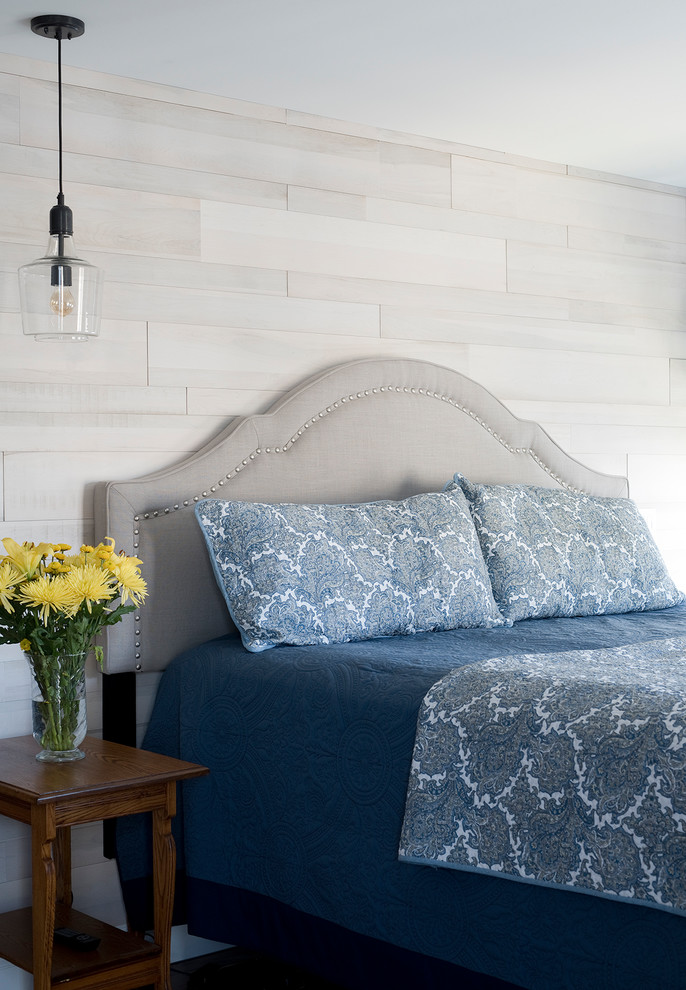 Design ideas for a beach style master bedroom in Portland Maine with no fireplace and grey walls.