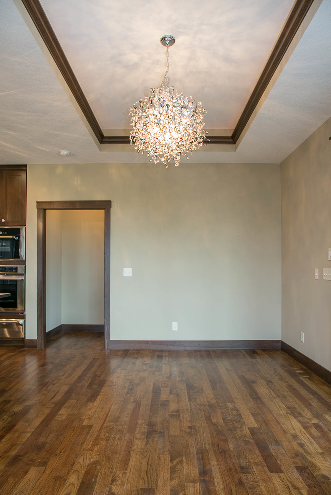 Inspiration for a transitional l-shaped dark wood floor open concept kitchen remodel in Minneapolis with a drop-in sink, shaker cabinets, dark wood cabinets, granite countertops, multicolored backsplash, ceramic backsplash, stainless steel appliances and an island