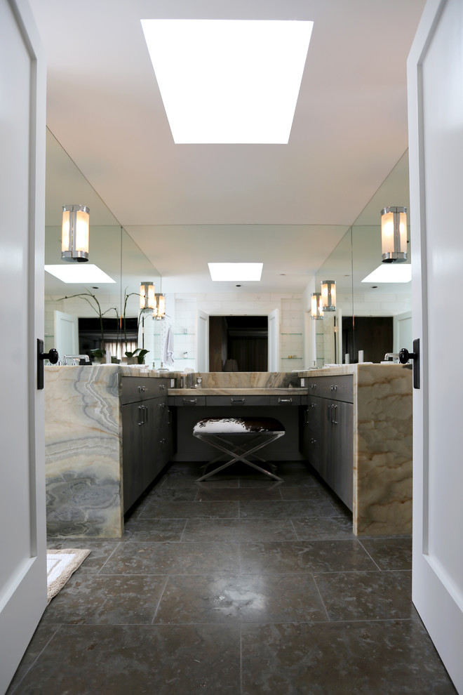 Large industrial master bathroom in San Diego with flat-panel cabinets, grey cabinets, marble benchtops, multi-coloured tile, stone tile, a drop-in tub, an open shower, a two-piece toilet, an undermount sink, white walls and limestone floors.