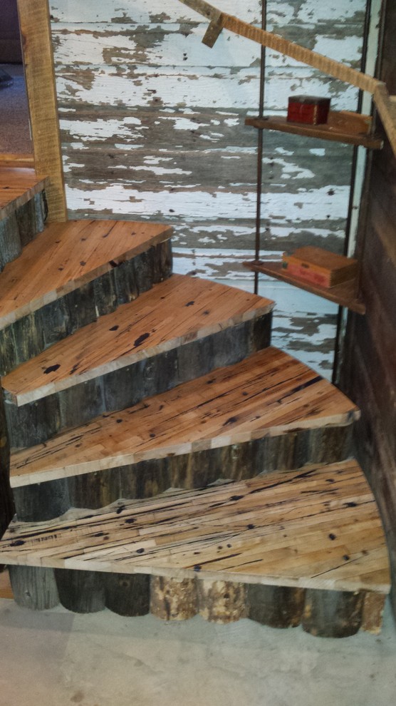 Example of a mid-sized mountain style wooden spiral wood railing home design design in Phoenix with wooden risers