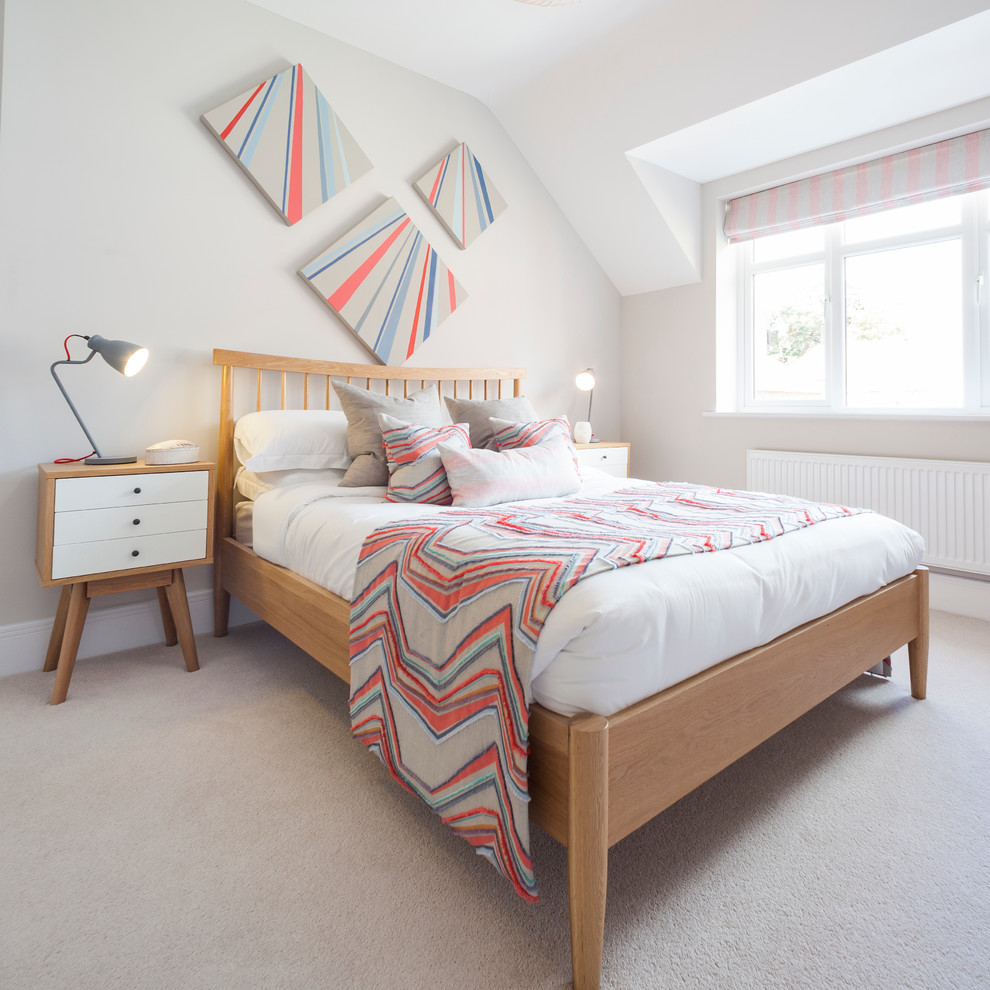 Design ideas for a transitional bedroom in Dorset with grey walls and carpet.