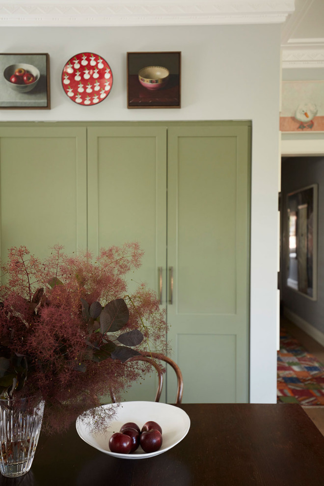 Mid-sized eclectic open plan dining in Sydney with medium hardwood floors, brown floor and blue walls.