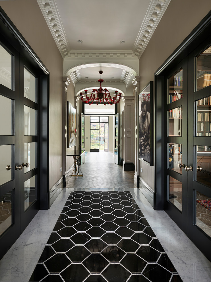 Expansive hallway in London with brown walls, marble floors and multi-coloured floor.