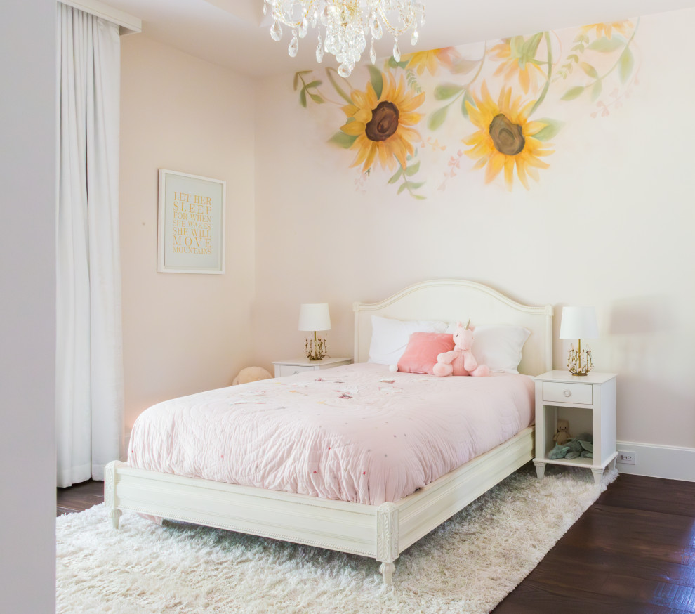 Photo of a transitional kids' room for girls and kids 4-10 years old in Houston with pink walls, dark hardwood floors and brown floor.