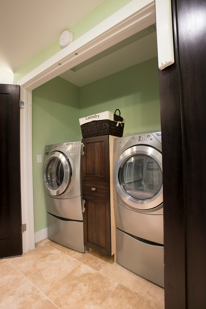 Example of a transitional home design design in Vancouver