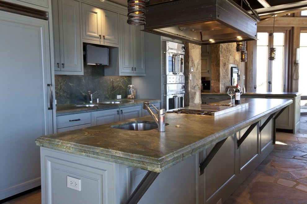Kitchen - large transitional kitchen idea in Denver with flat-panel cabinets, dark wood cabinets and an island