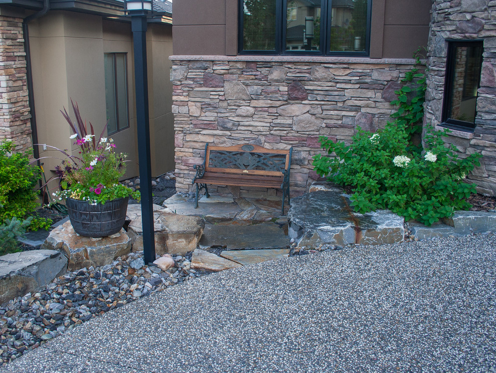 Design ideas for a large traditional partial sun backyard stone outdoor sport court in Calgary for summer.