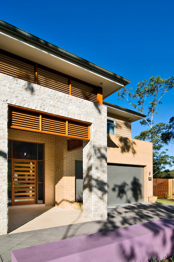 Photo of a contemporary two-storey brick exterior in Sydney.