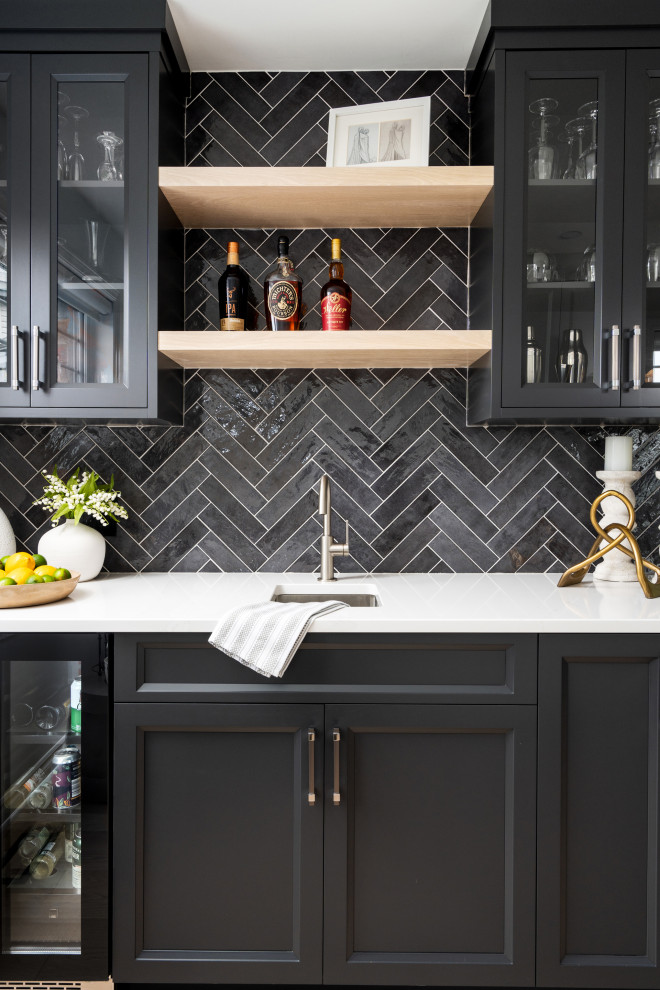 Design ideas for a large classic single-wall home bar in Montreal with a submerged sink, beaded cabinets, white cabinets, engineered stone countertops, grey splashback, ceramic splashback, light hardwood flooring, brown floors and white worktops.