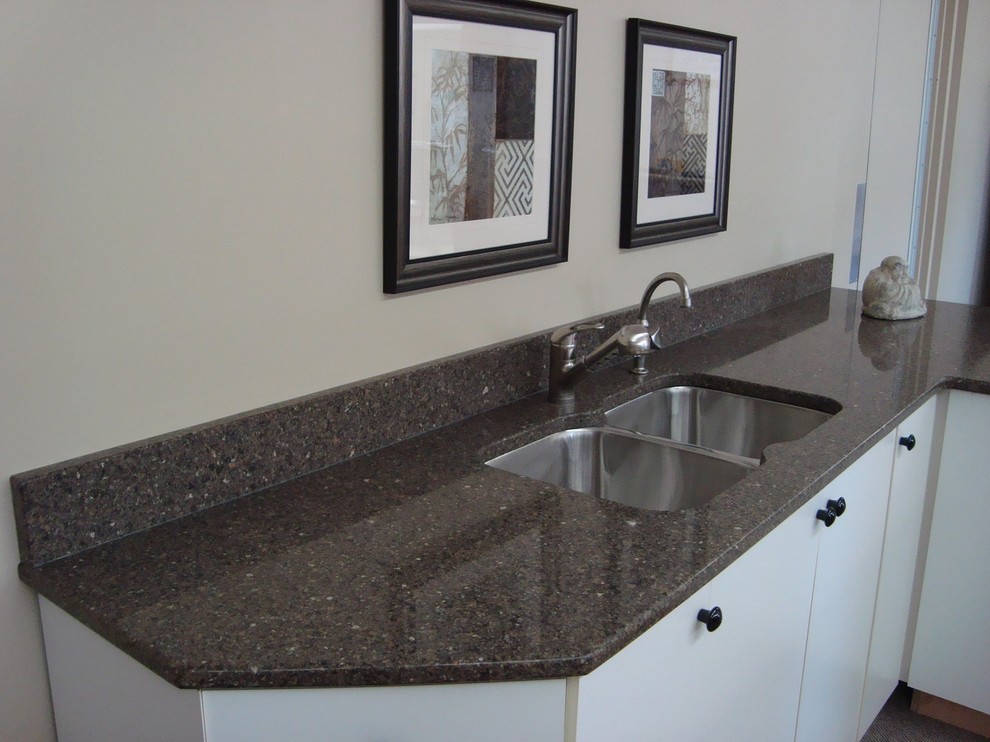 Inspiration for a transitional kitchen remodel in Orange County with a double-bowl sink, flat-panel cabinets, white cabinets and granite countertops