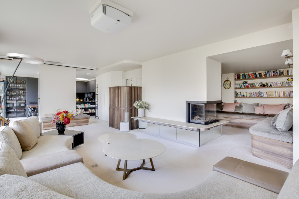 Photo of a large contemporary open concept family room in Paris with a library, white walls, carpet, a standard fireplace, a plaster fireplace surround, a concealed tv and beige floor.
