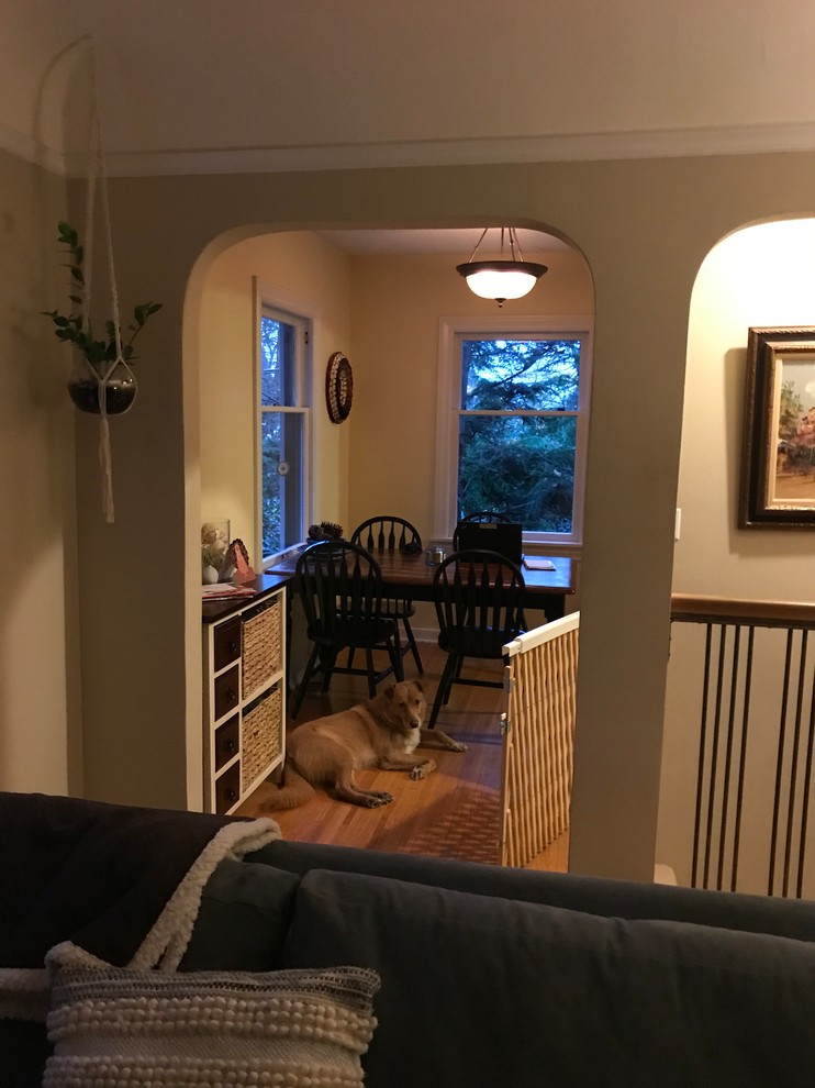 Inspiration for a mid-sized transitional galley ceramic tile and gray floor eat-in kitchen remodel in Seattle with an undermount sink, shaker cabinets, green cabinets, quartz countertops, white backsplash, brick backsplash, stainless steel appliances, no island and beige countertops