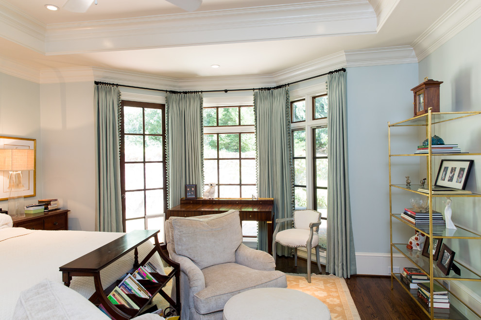 Photo of a mid-sized traditional master bedroom in Atlanta with blue walls and dark hardwood floors.