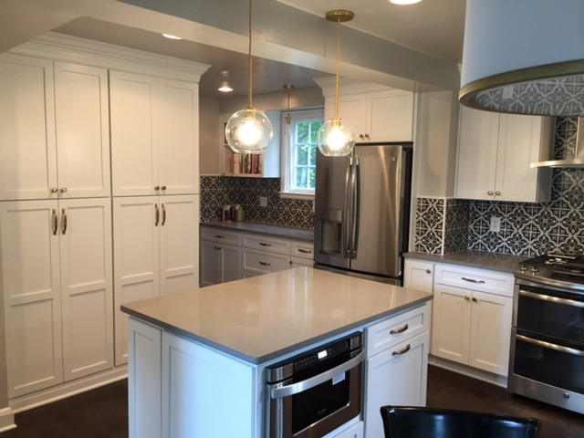 Statement Patterned-Tile Backsplash in a Contemporary, Neutral Kitchen
