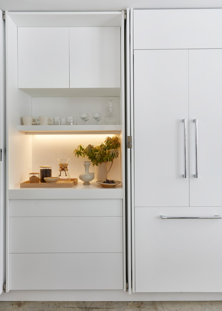 This is an example of a scandinavian kitchen in New York with white benchtop.