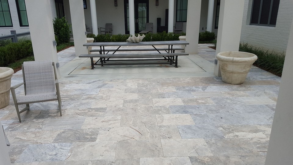 Inspiration for a large transitional backyard stone patio remodel in Miami with no cover