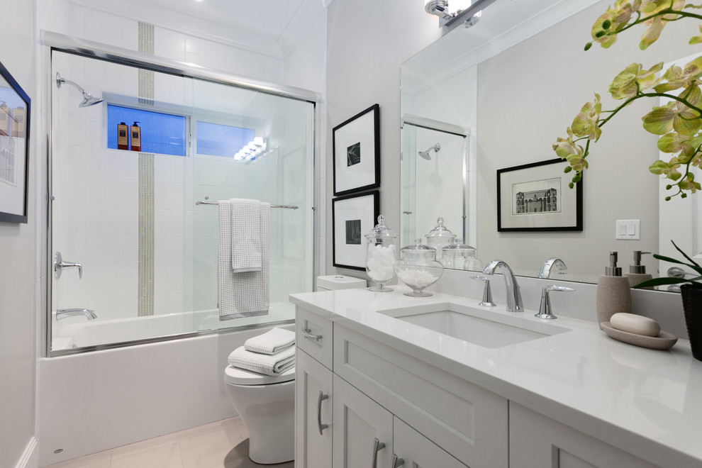 Example of a transitional home design design in Vancouver