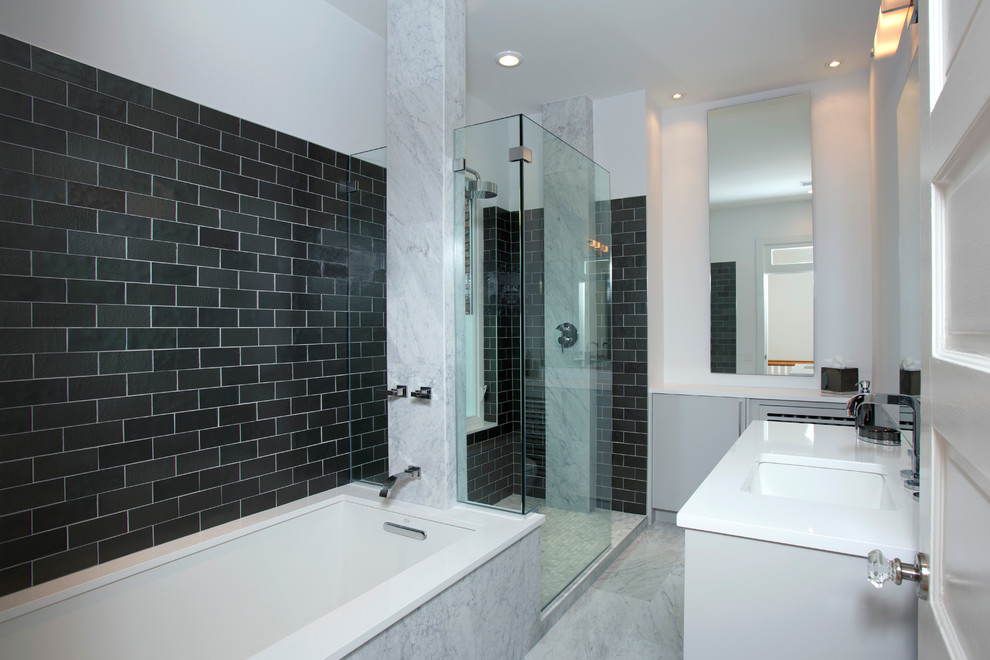 Mid-sized contemporary master bathroom in DC Metro with flat-panel cabinets, grey cabinets, an alcove shower, a one-piece toilet, black tile, gray tile, white tile, marble floors, an undermount sink, solid surface benchtops, an alcove tub, stone tile and white walls.