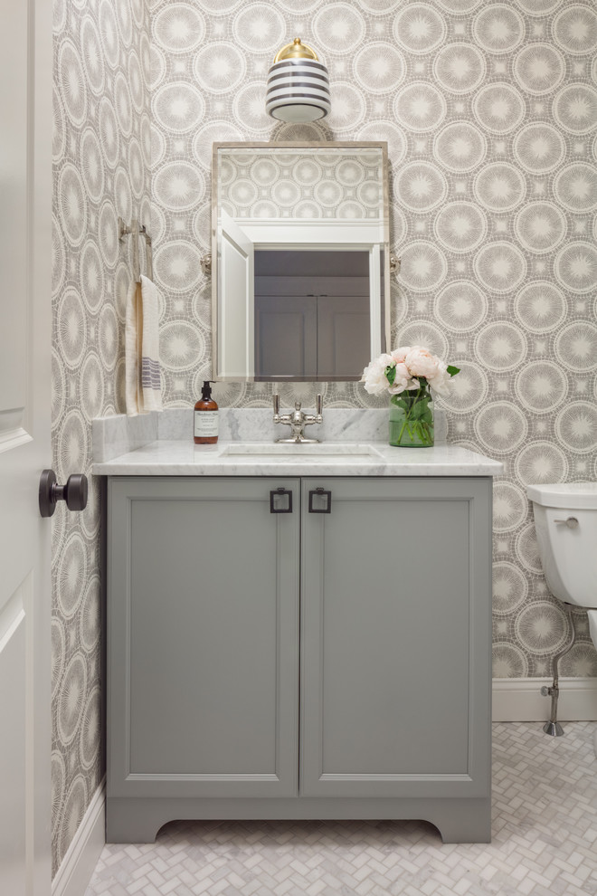 Transitional powder room in Boston with recessed-panel cabinets, grey cabinets, marble floors, an undermount sink, marble benchtops, grey floor and grey walls.