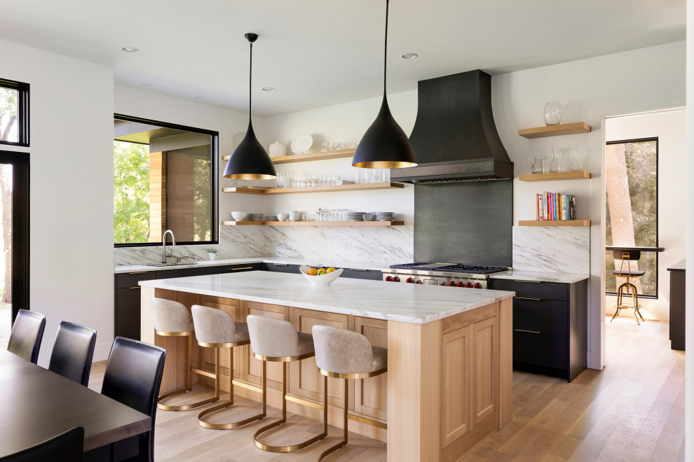 Inspiration for a transitional l-shaped eat-in kitchen in Minneapolis with an undermount sink, medium wood cabinets, grey splashback, stainless steel appliances, medium hardwood floors, with island and brown floor.
