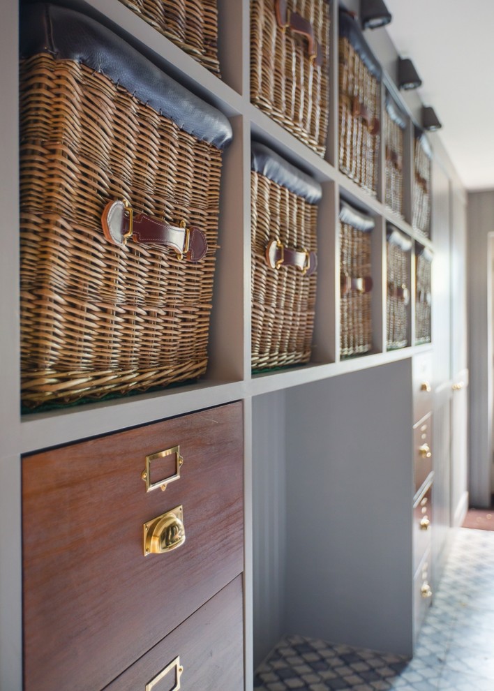 Design ideas for a traditional storage and wardrobe in London with shaker cabinets, grey cabinets, porcelain floors and multi-coloured floor.