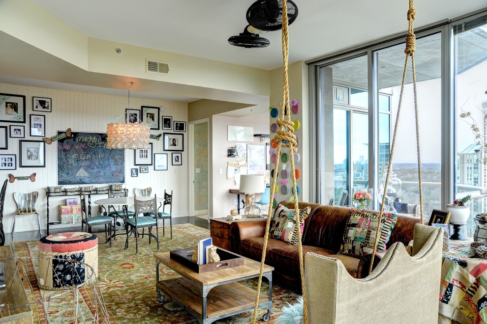 Mid-sized eclectic formal open concept living room in Atlanta with beige walls, medium hardwood floors, no fireplace, no tv and brown floor.