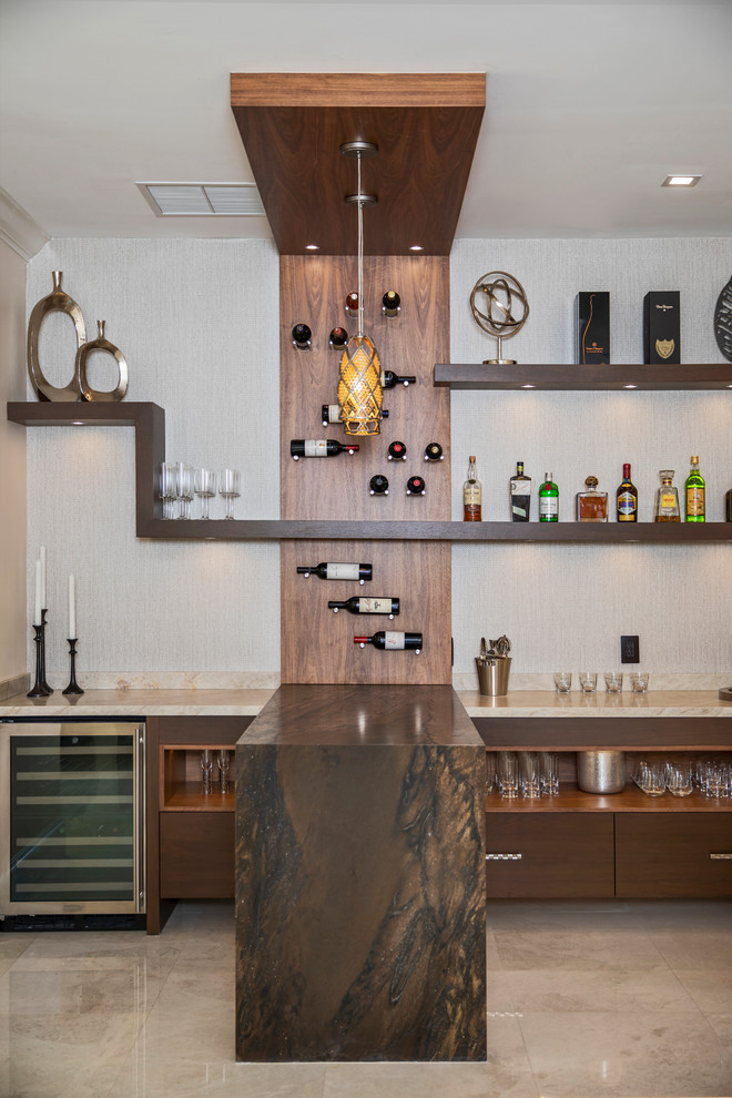 This is an example of a contemporary home bar with flat-panel cabinets, dark wood cabinets, beige floor and brown benchtop.