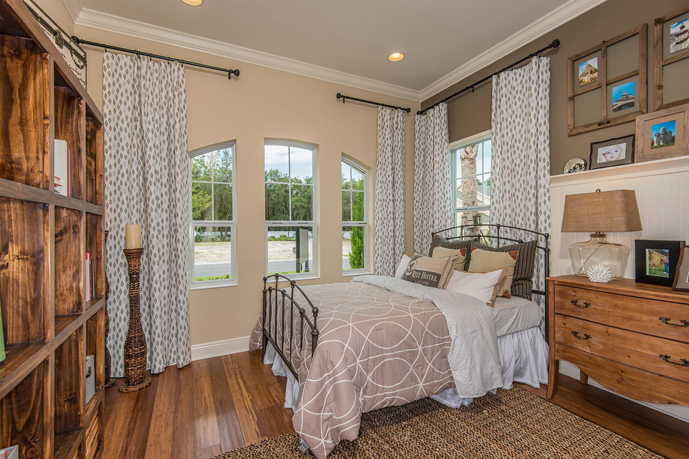 Design ideas for a country bedroom in Tampa with beige walls and medium hardwood floors.