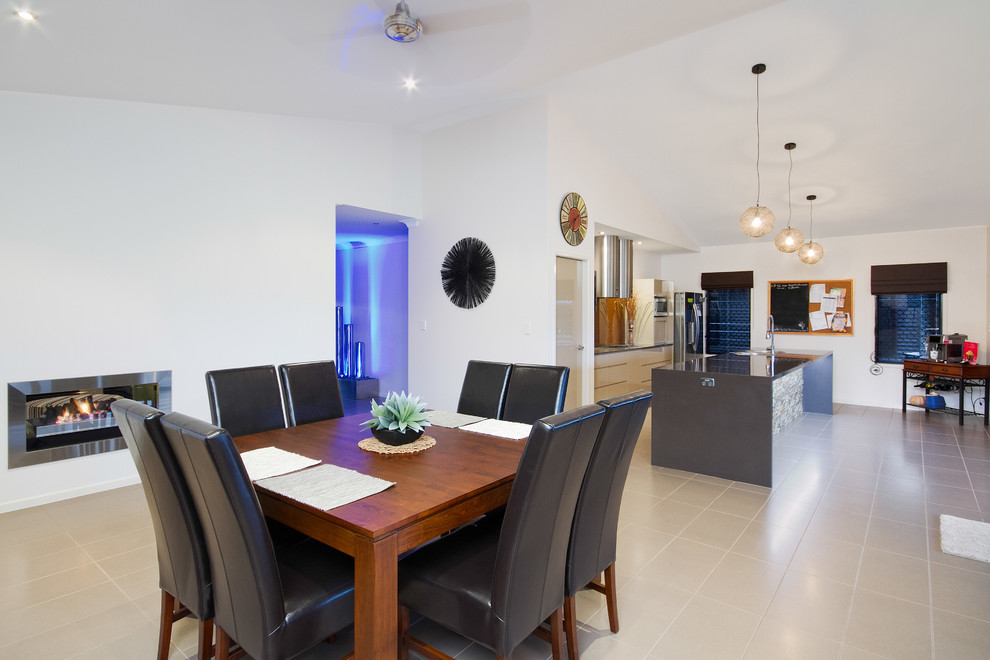 Inspiration for a large contemporary kitchen/dining combo in Cairns with white walls.