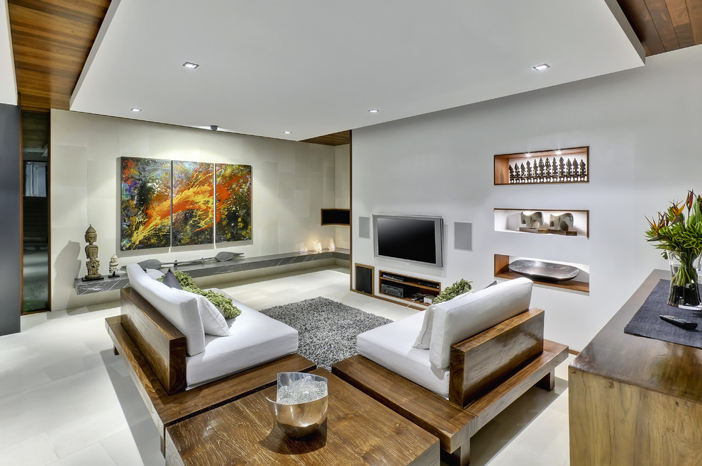 Contemporary living room in Brisbane with white walls and a wall-mounted tv.