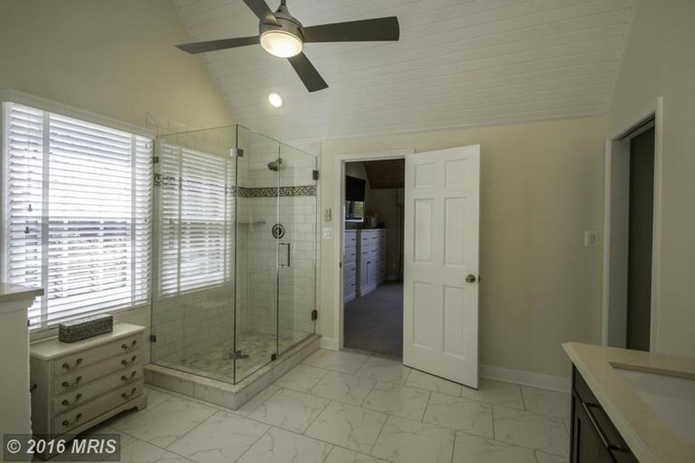 Mid-sized transitional beige tile and ceramic tile home design photo in Baltimore with raised-panel cabinets, white cabinets, white walls, a vessel sink and granite countertops