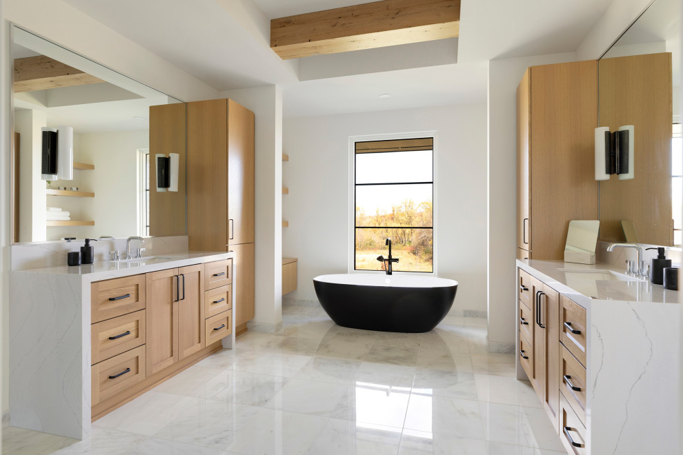 Photo of a country master bathroom in Minneapolis with light wood cabinets, a freestanding tub, white walls, marble floors, an undermount sink, engineered quartz benchtops, white floor, white benchtops, a double vanity, a built-in vanity, exposed beam and shaker cabinets.