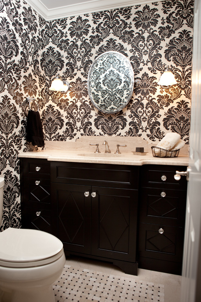Traditional powder room in Minneapolis with black cabinets and beige benchtops.