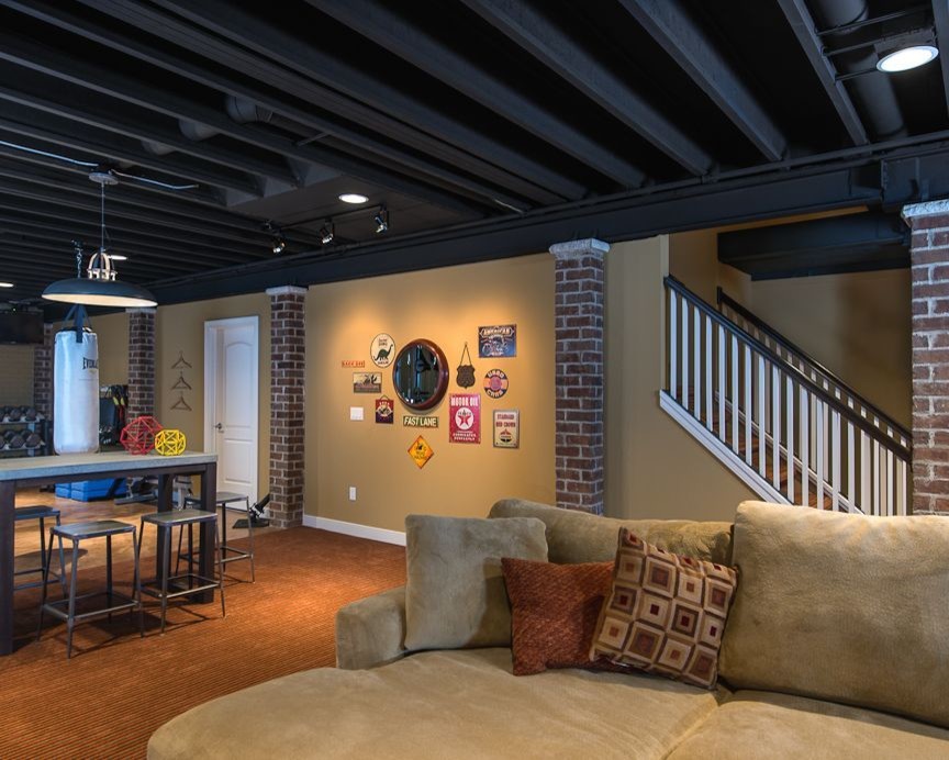 Inspiration for a contemporary orange floor basement remodel in Detroit