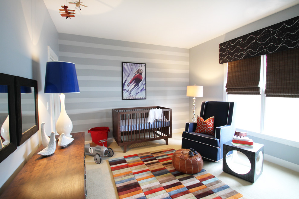 Design ideas for a mid-sized eclectic nursery for boys in Charlotte with grey walls and carpet.