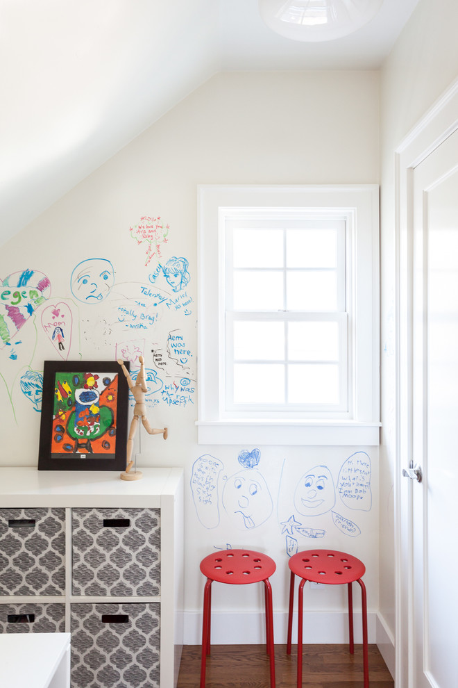 Contemporary gender-neutral kids' playroom in Sacramento with white walls and medium hardwood floors.